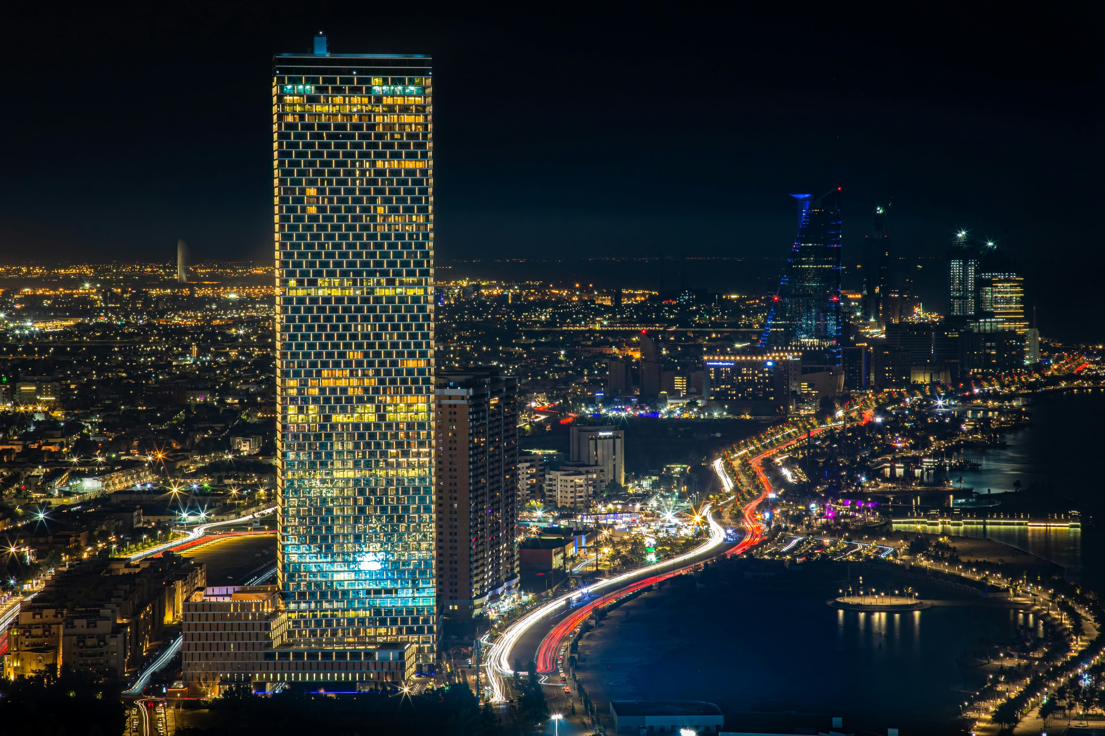 Luxury residential properties with Dubai skyline at night